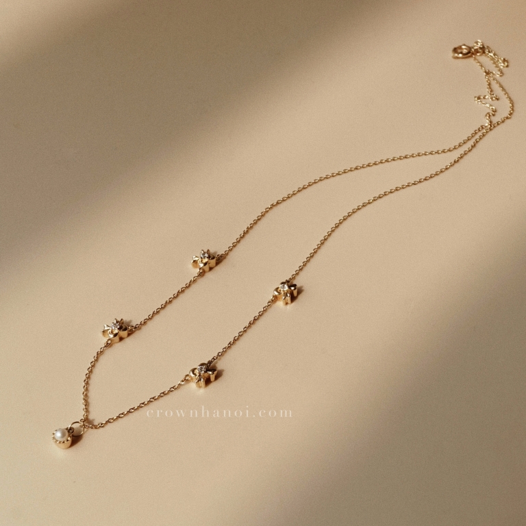 MULTI RIBBON PEARL NECKLACE